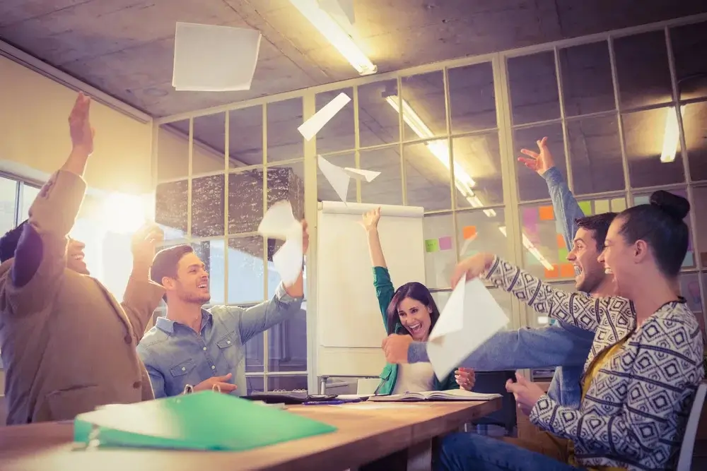 Group-of-business-people-celebrating-by-throwing-their-business-papers-in-the-air-1 (1)